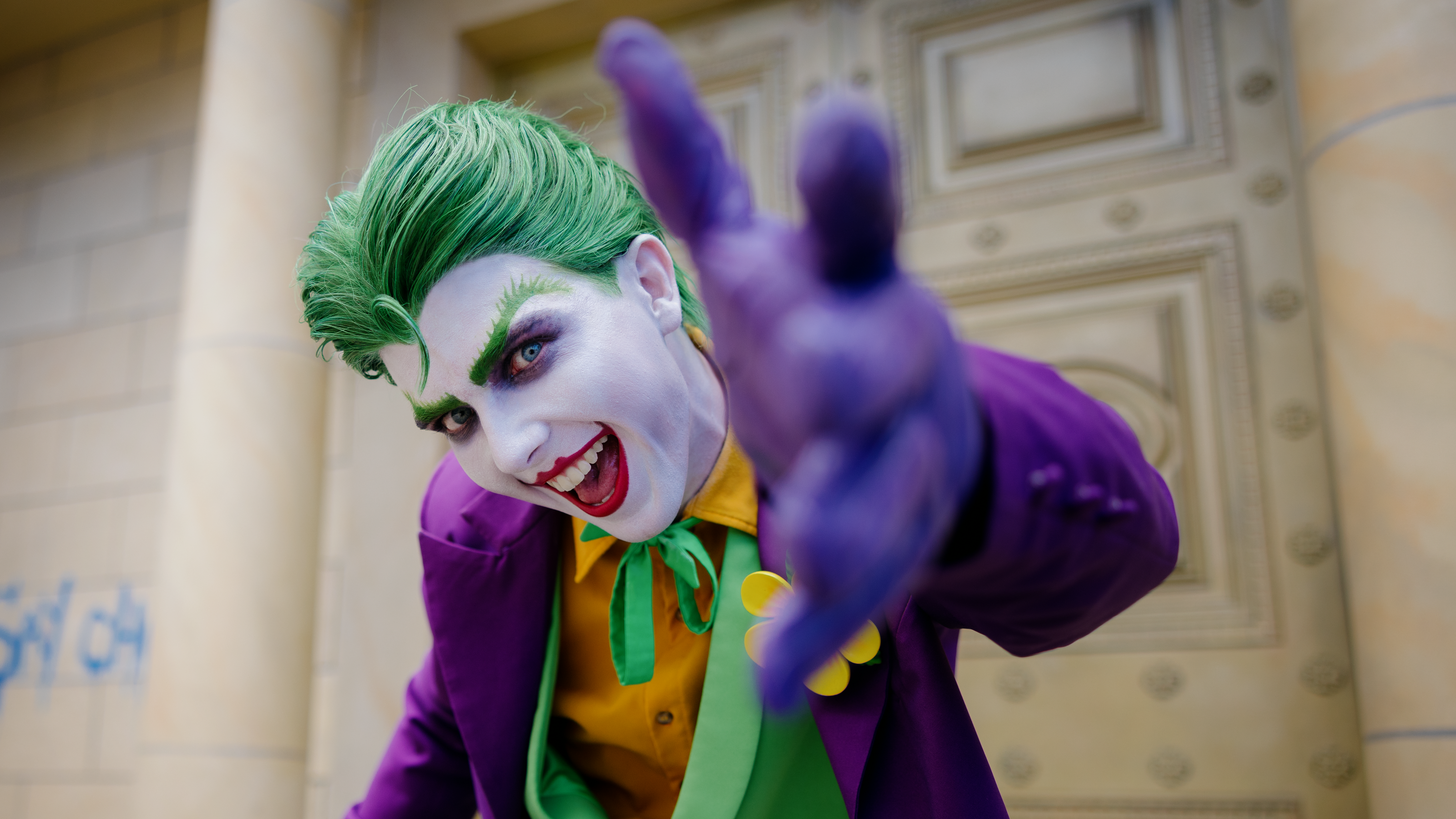 A close-up of The Joker, the iconic supervillain character, at Warner Bros. Movie World, showcasing his mischievous grin and distinctive features