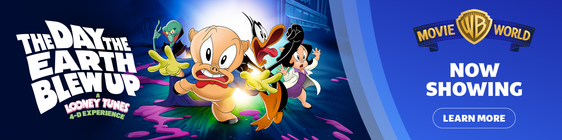 Looney Tunes characters run from an explosion with "The Day The Earth Blew Up: Looney Tunes Experience" text on the left. On the right, a Movie World banner says "NOW SHOWING" with a "Learn More" button.