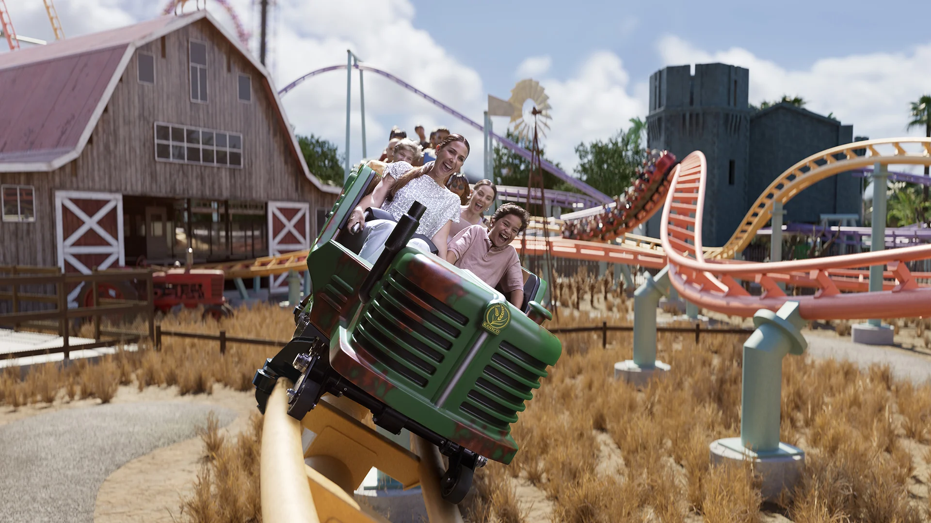 A family enjoying a thrilling ride on the Kansas Twister family ride at Warner Bros. Movie World, experiencing twists and turns in a fun and exciting atmosphere