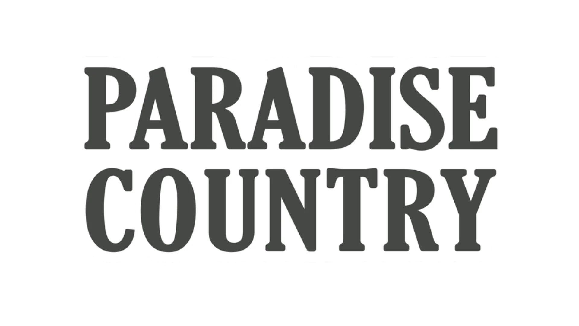 The image features the bold, uppercase words "PARADISE COUNTRY" in black, serif font against a plain white background.