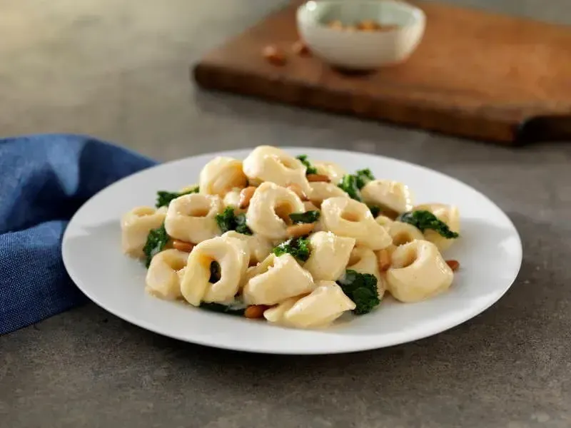Barilla® Three Cheese Tortellini with Creamy Parmigiano Sauce, Kale & Pine Nuts-image