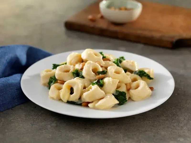 Barilla® Three Cheese Tortellini with Creamy Parmigiano Sauce, Kale & Pine Nuts-image