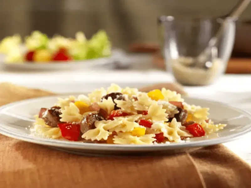 Mini Farfalle Pasta with Sausage, Peppers and Pecorino Cheese | Barilla