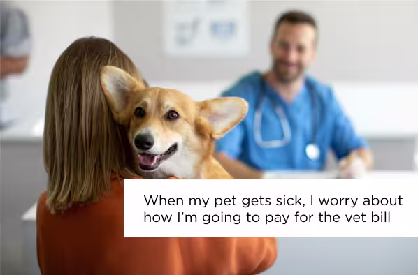 Woman holding corgi at vet