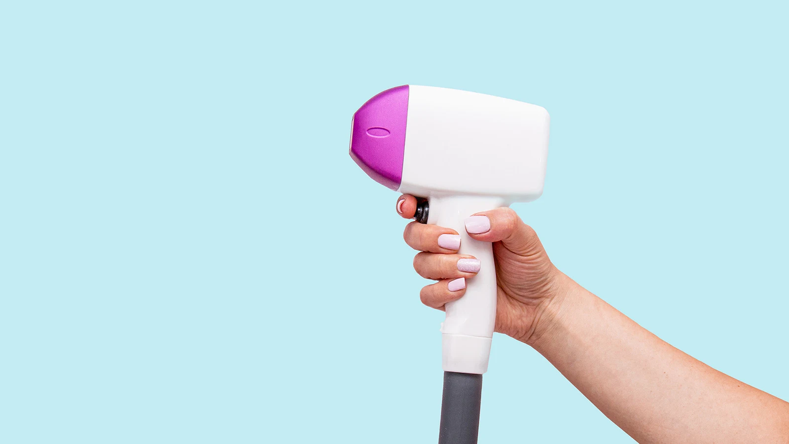 Female holding laser hair removal Device
