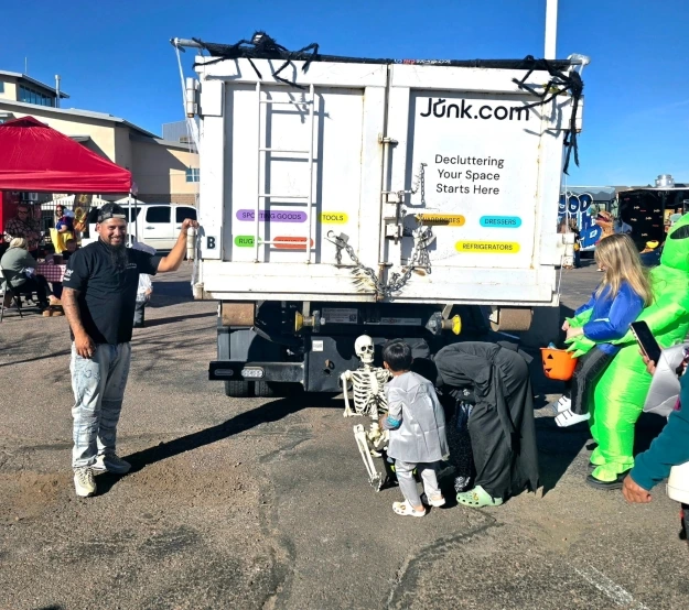 Kids investigate the plastic Halloween decorations decorating the Junk.com truck at the 2025 Meridian Ranch Trunk or Treat.