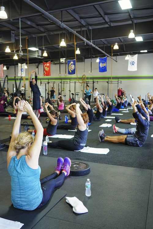 A group of people training  in a gym
