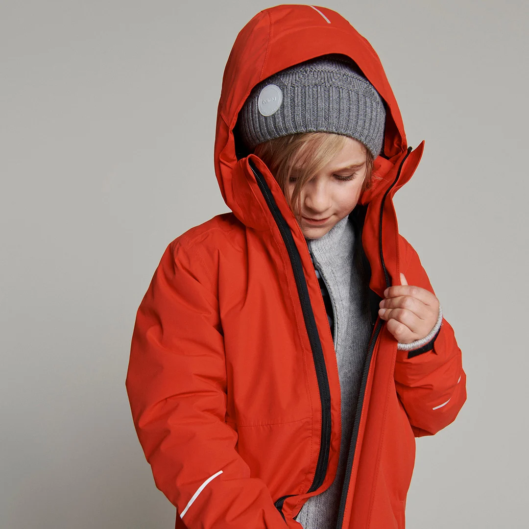 kid-wearing-red-recycable-jacket-reima