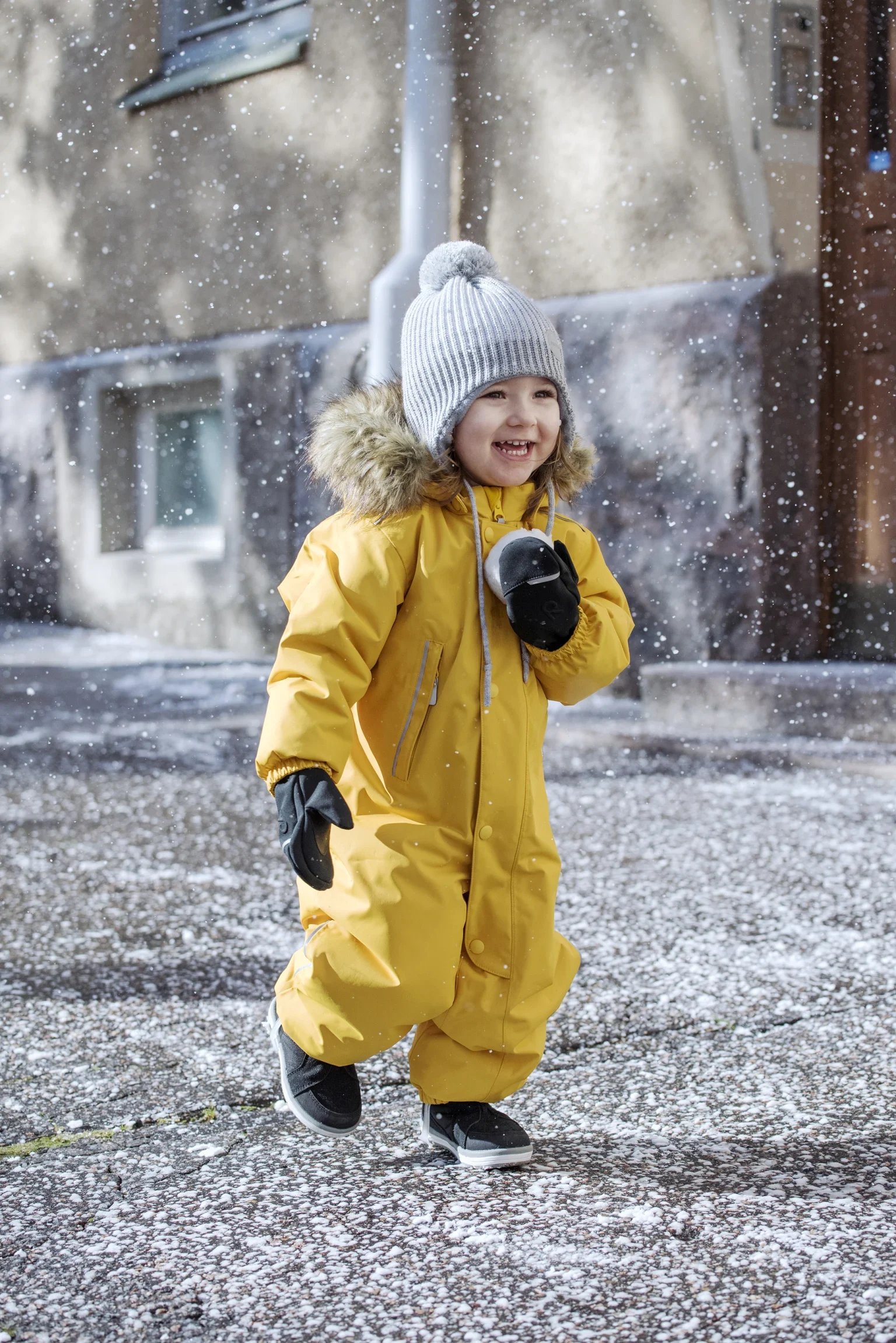 toddler-enjoying-winter-with-reima-snowsuit.jpg
