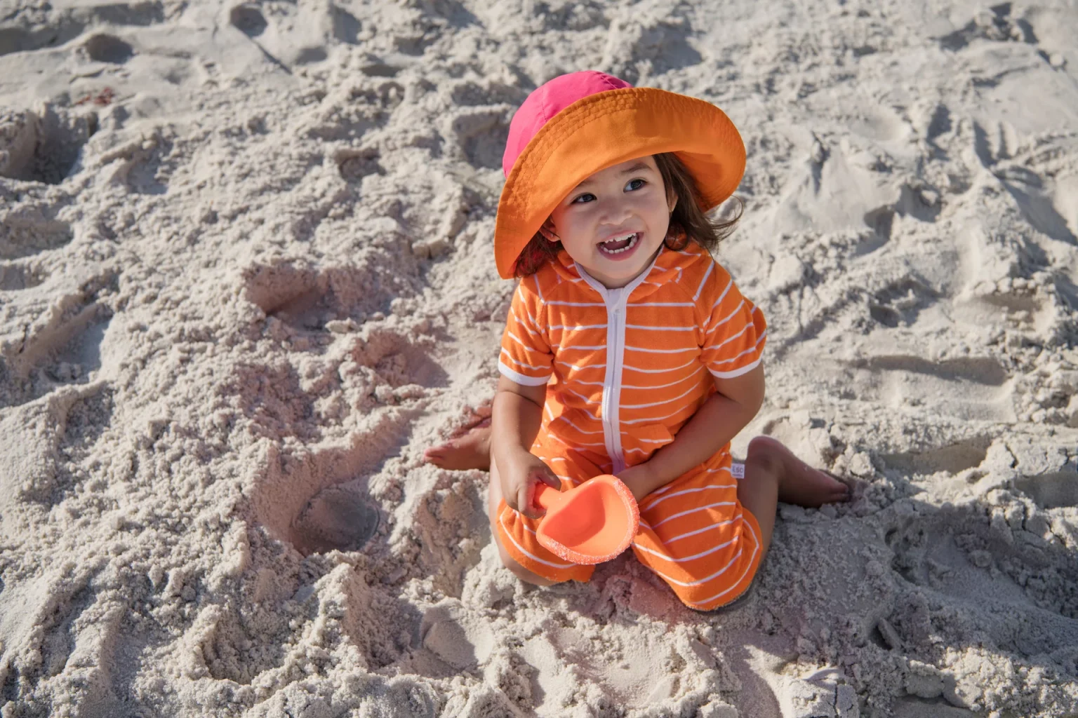 child-playing-outside-in-the-sand.jpg