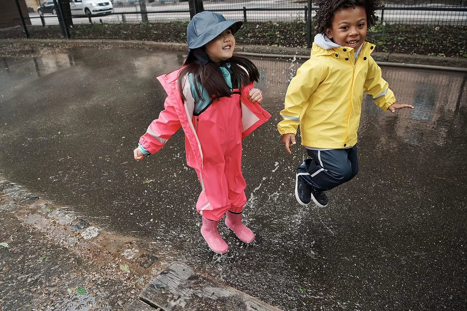 children-enjoying-playing-outside-on-rainy-day.jpg