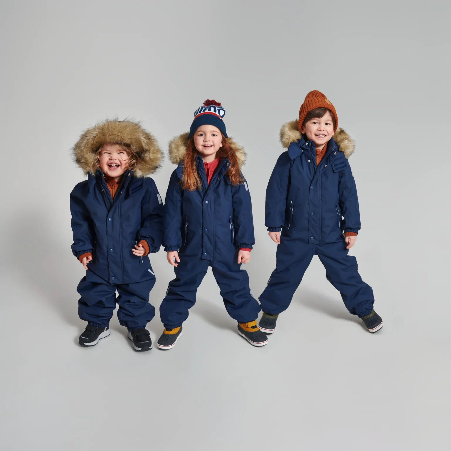 kids-looking-happy-with-reima-snowsuits.jpg