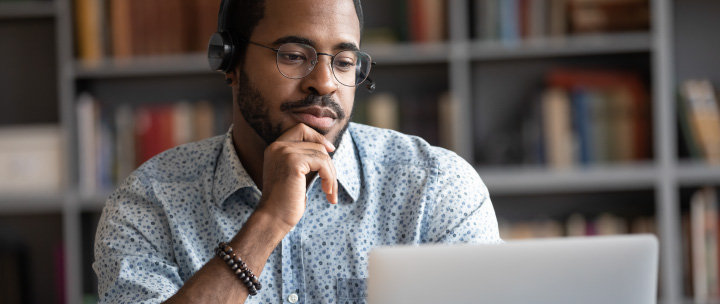 Man watching a webinar on-demand