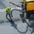 Road construction worker maintaining road by crack sealing 