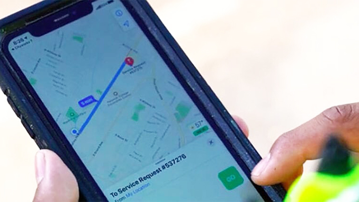 Closeup of mobile device showing graffiti service request