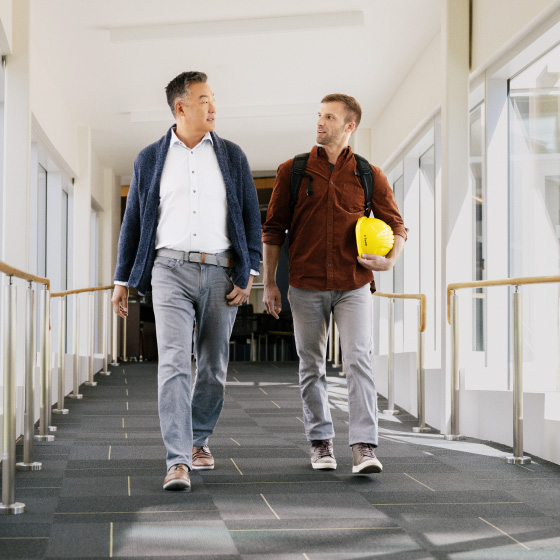 Two men working together to deliver innovation