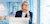 Businesswoman on computer looking out window