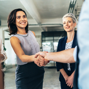 Woman shaking hands with someone.