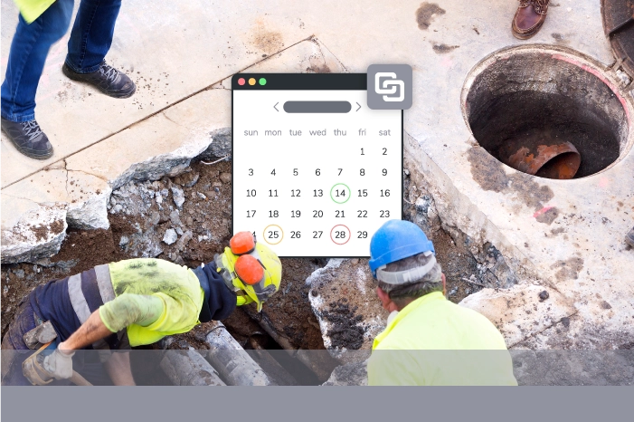 Construction workers digging sewage line with software showing calendar