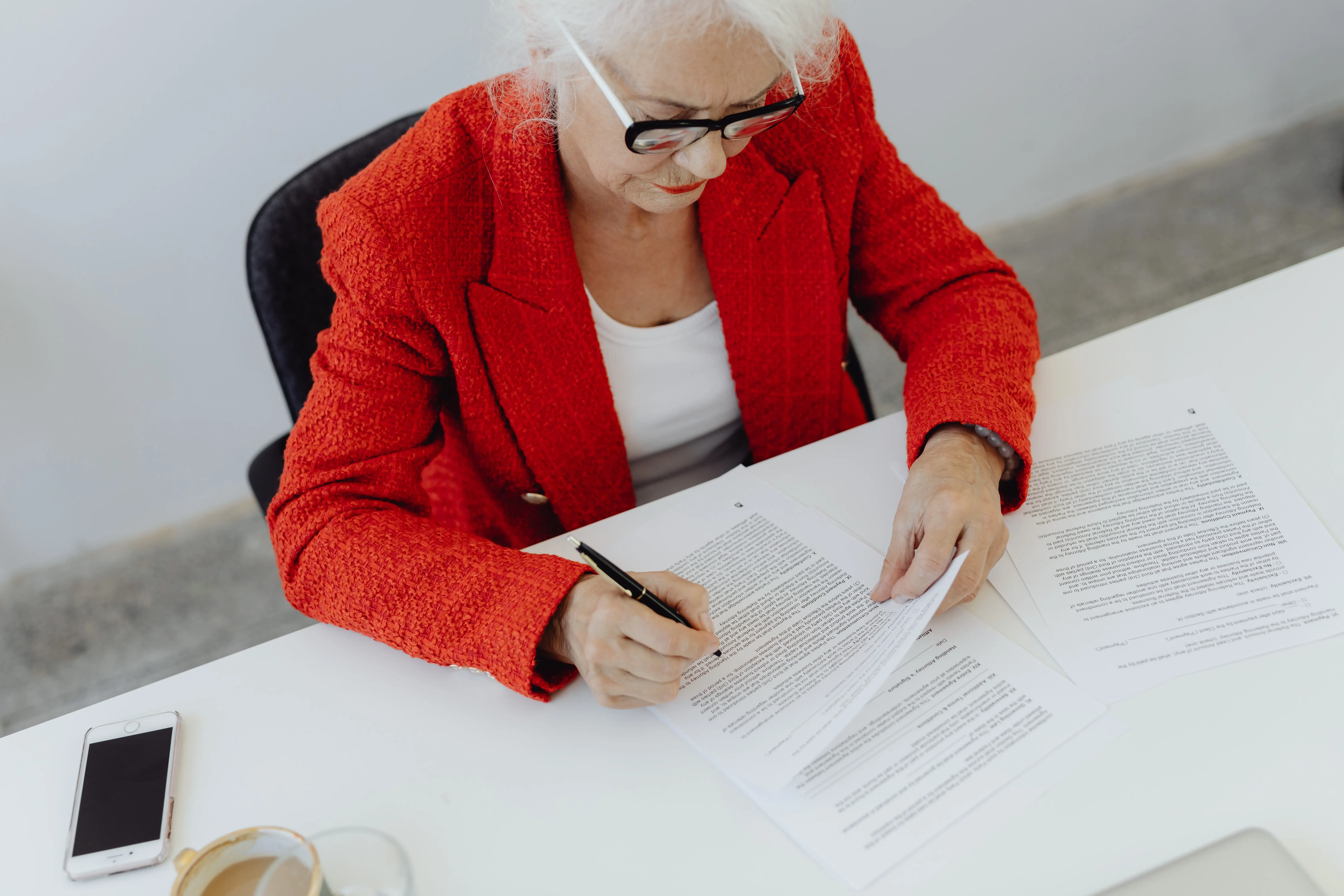 A woman reads a contract