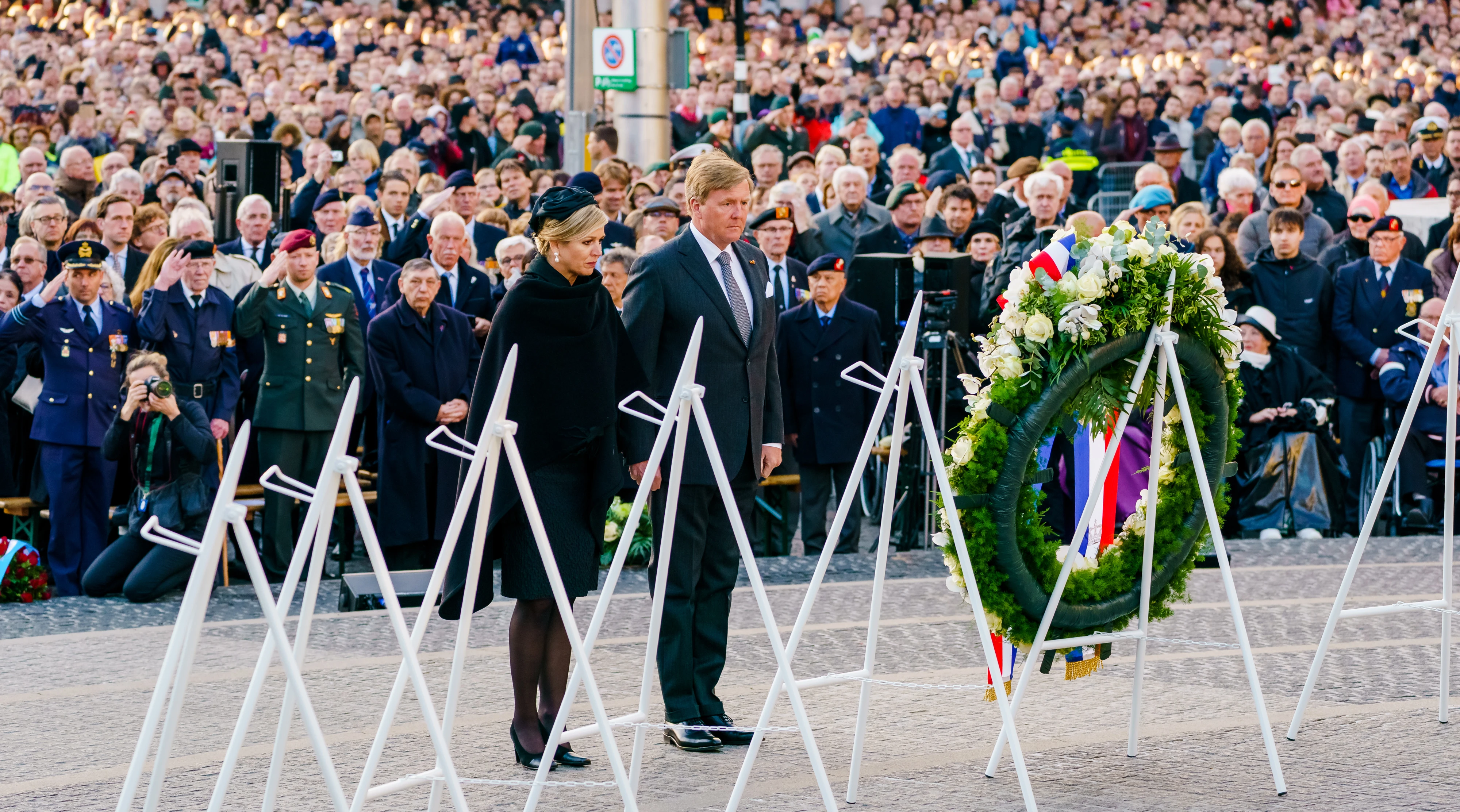The Dutch king and queen lay a wreath on Dam Square in Amsterdam.