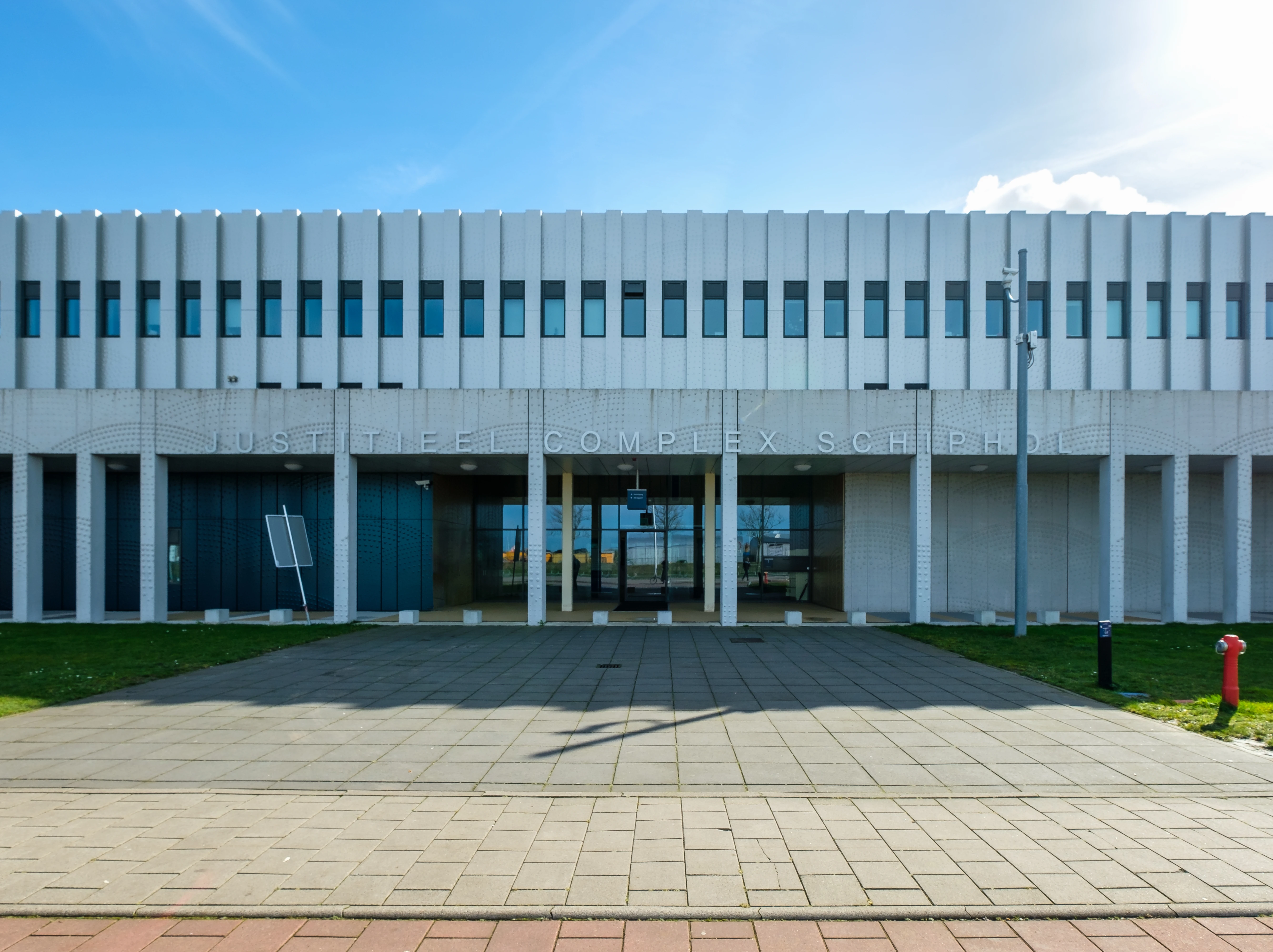 Front view of the Schiphol Judicial Complex, where asylum seekers arriving in the Netherlands at an airport or port must await their asylum procedure.