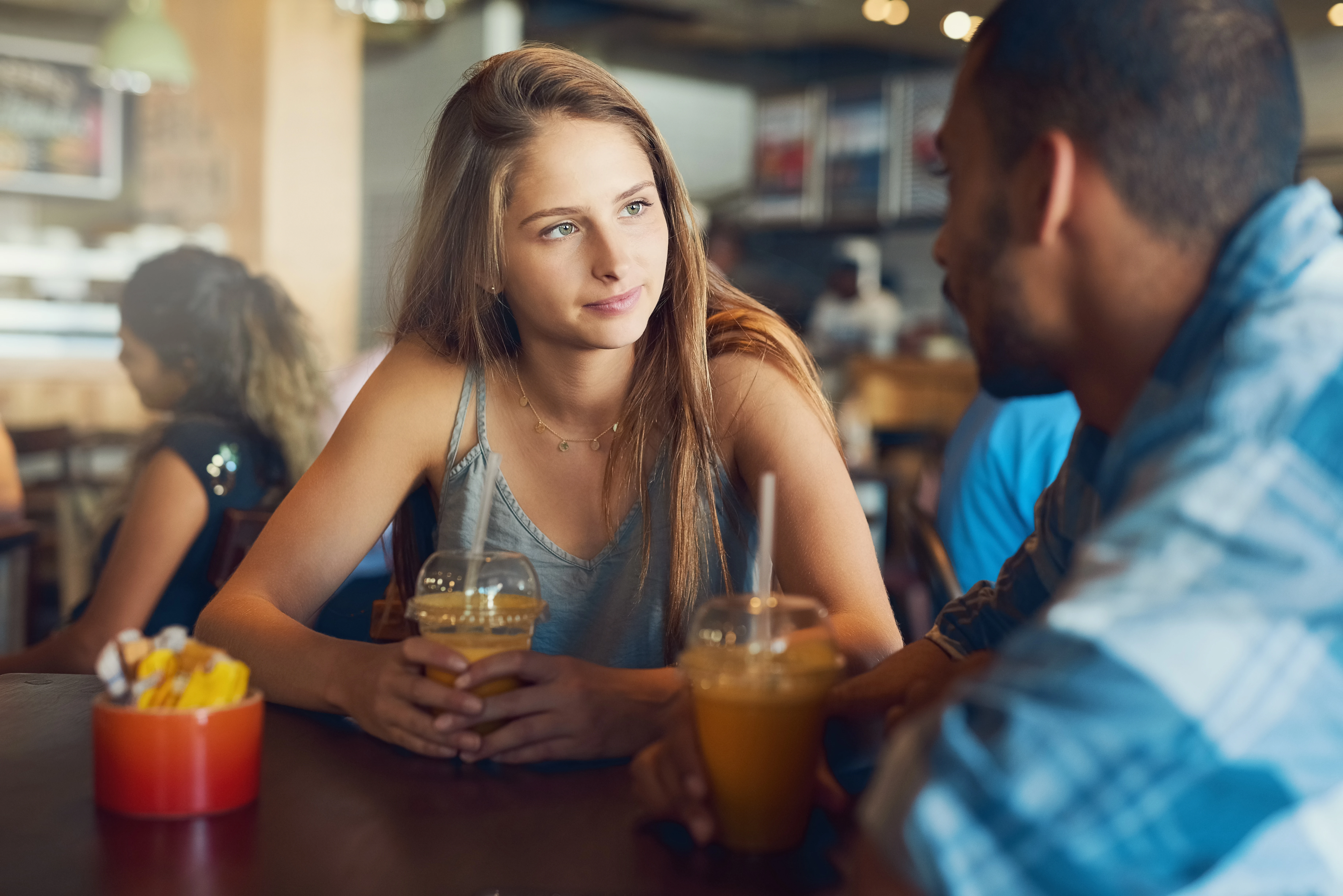 2 people drink coffee during their date.