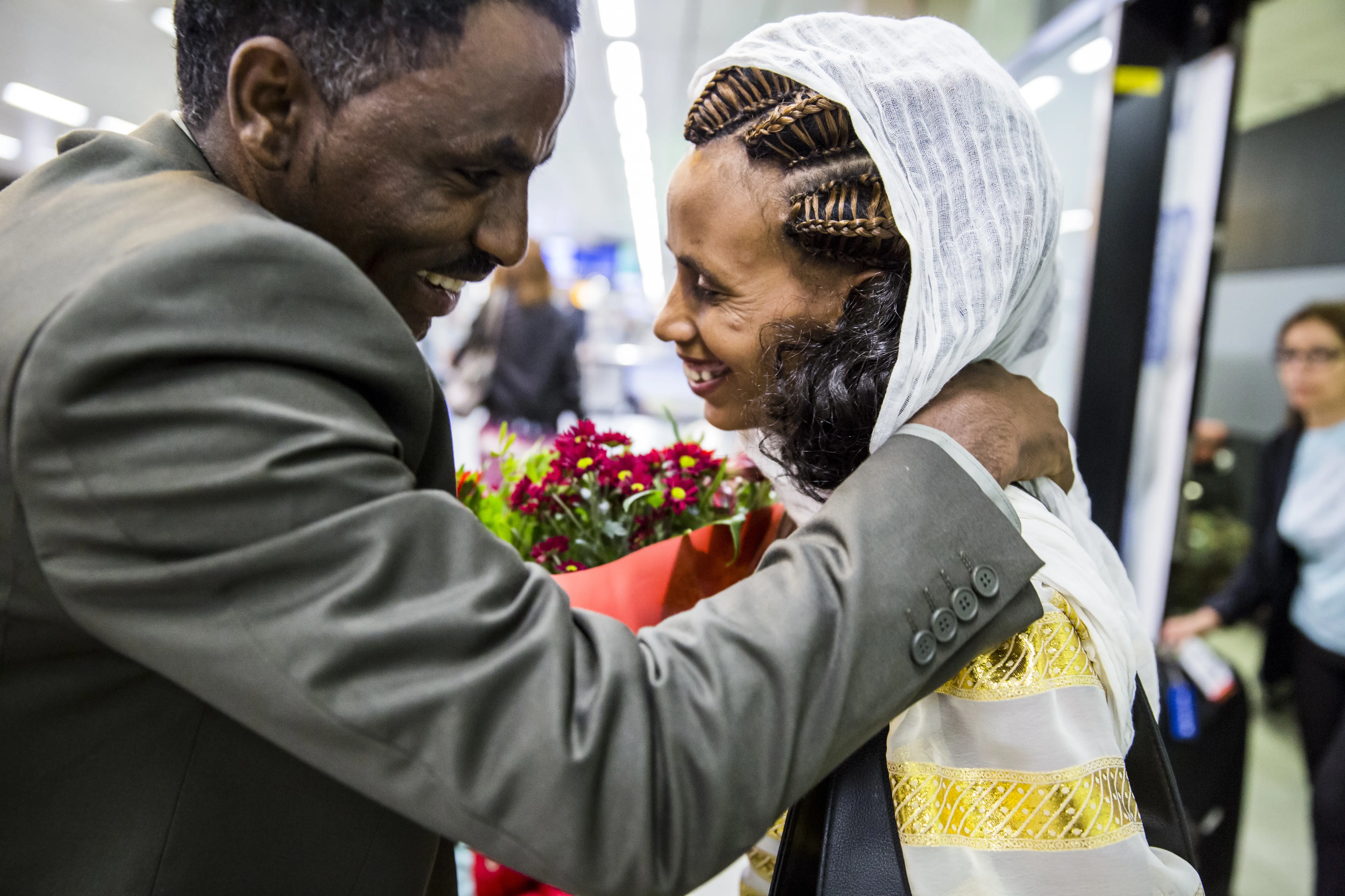 A married man and woman finally see each other again after family reunification.