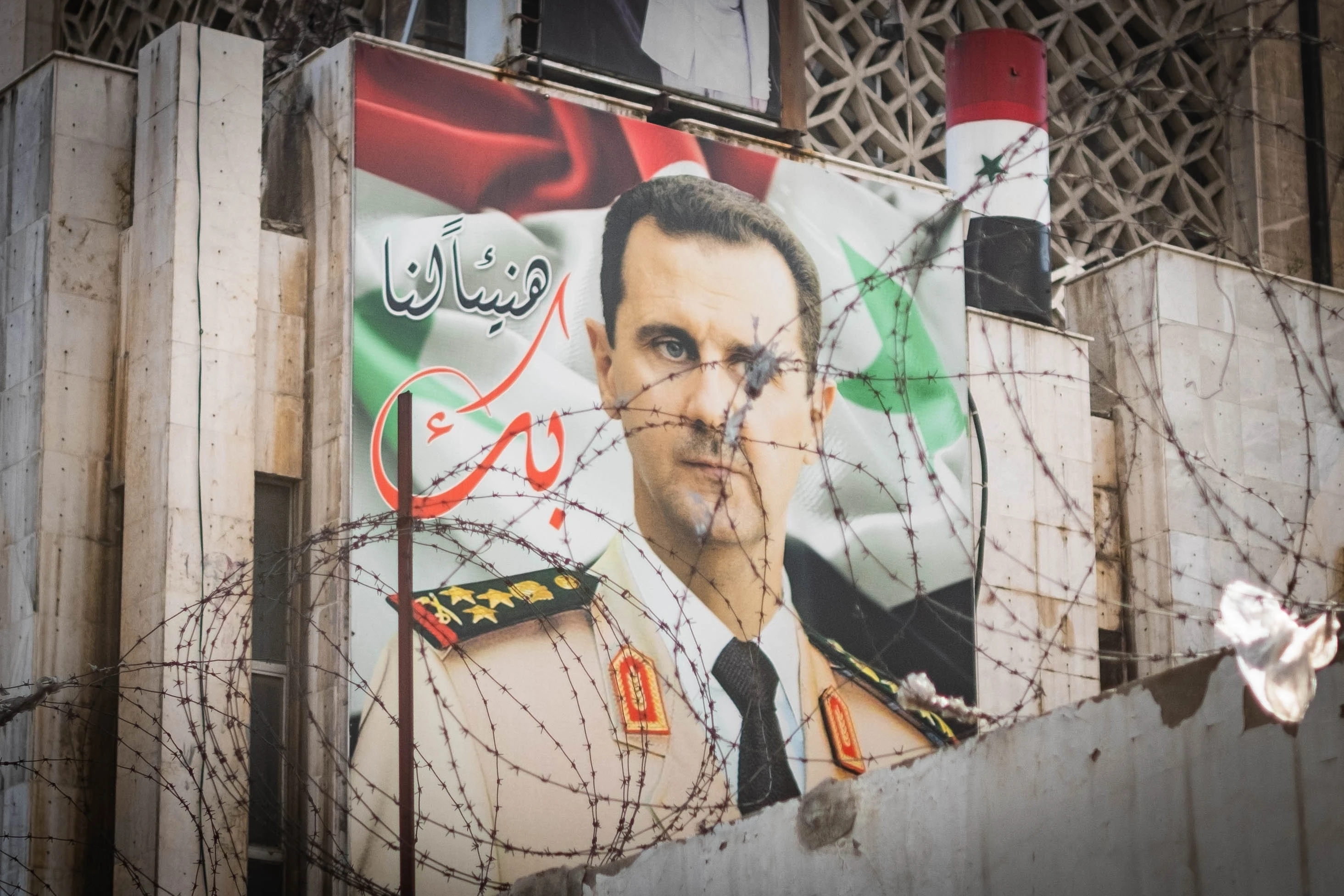 A large portrait of Bashar al-Assad on a building in Damascus, Syria