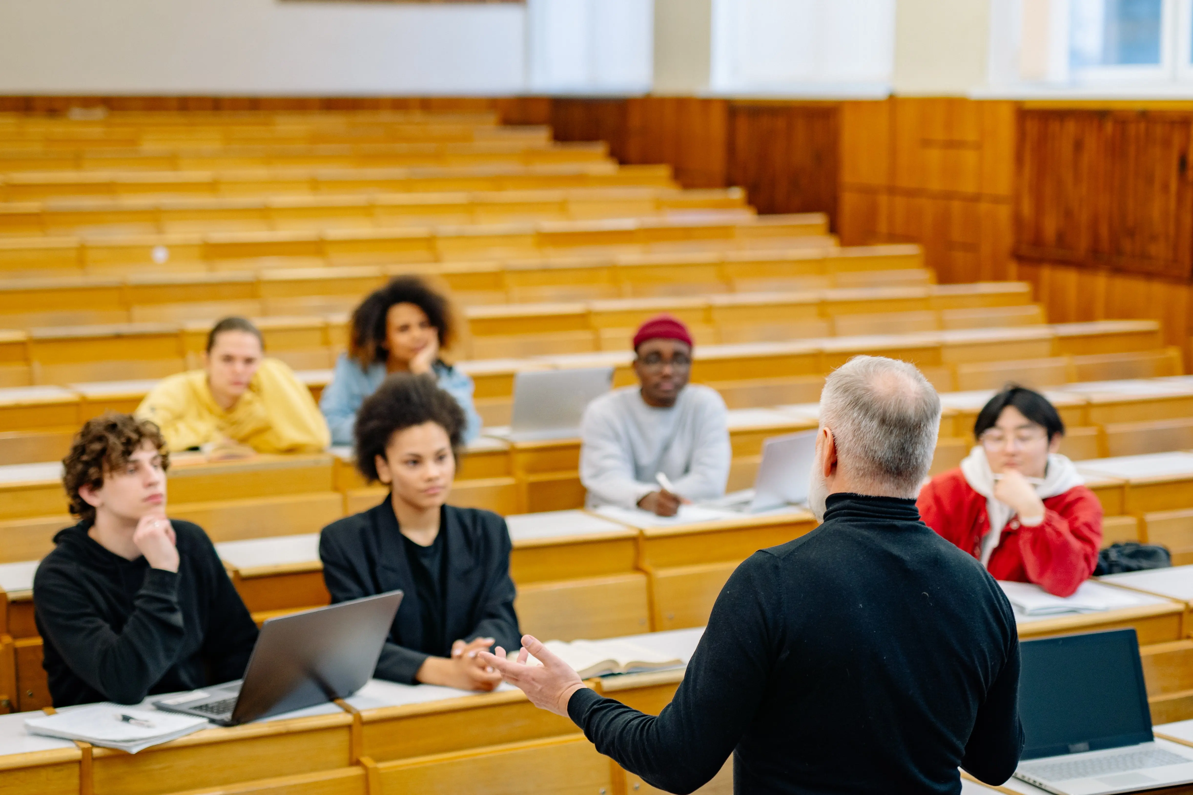 Students sit in the lecture hall.