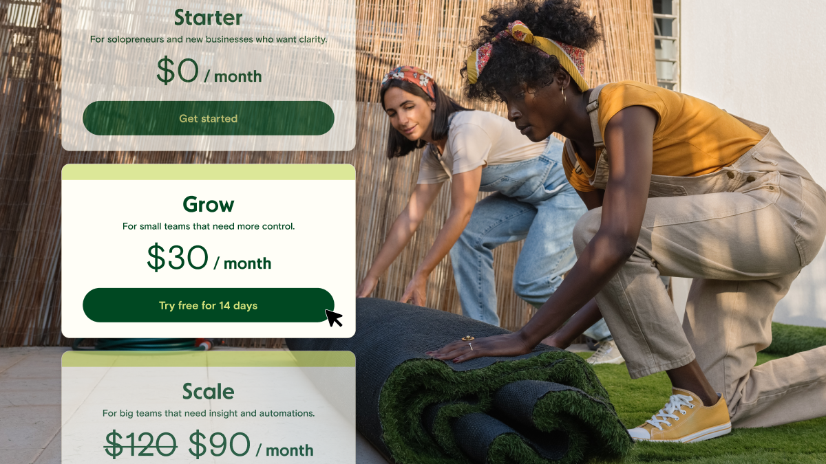 Two female gardeners rolling out turf. There is a snippet of a pricing screen with Grow $30/month on the screen.