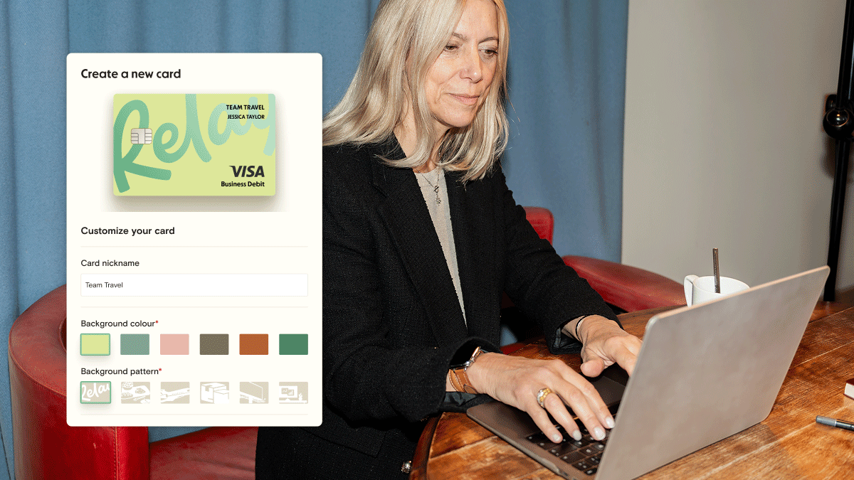 A woman is sitting at a laptop typing. There is a product overlay on top flipping between different designs of a visa card, some are green, some are pink, some are brown. They also have different designs on them, like a plane or plates.