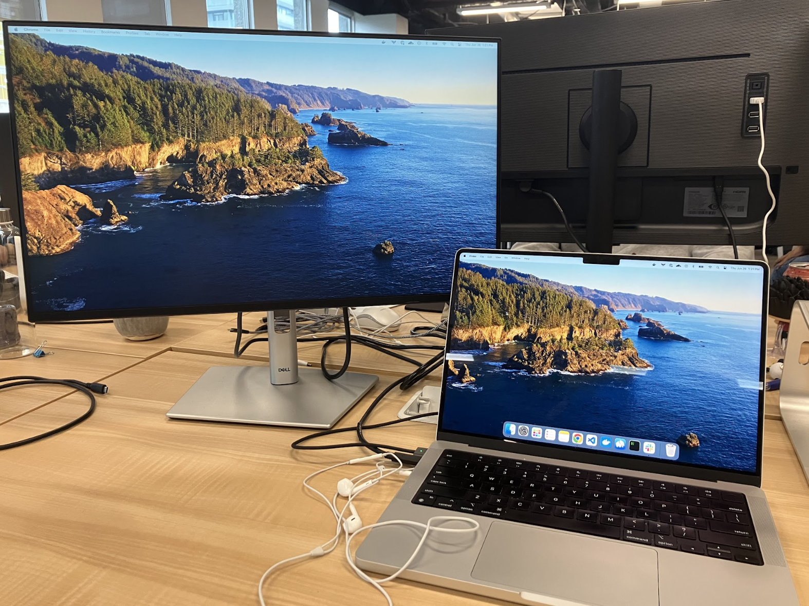 Image of a computer and additional monitor on a desk. 