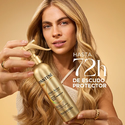 Mujer rubia con el tratamiento pro-tector en spray Molecular Bond Repair con hasta 72 horas de escudo protector