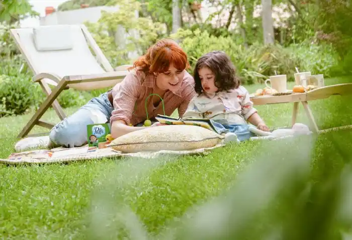 Mother and her daughter sitting in the park