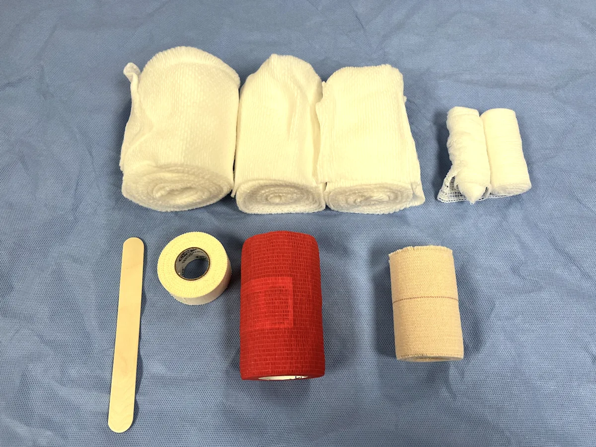 Bandage supplies on surgical drape.