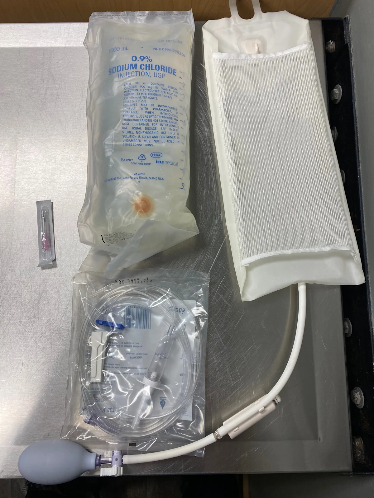 IV fluid bags and pressure infusion cuff.