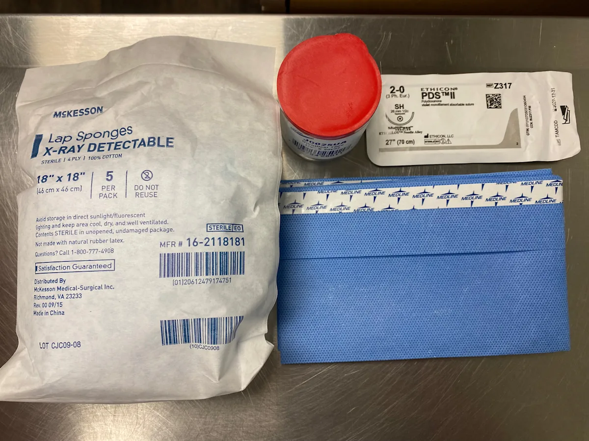 Materials for a tie-over bandage in a small animal.