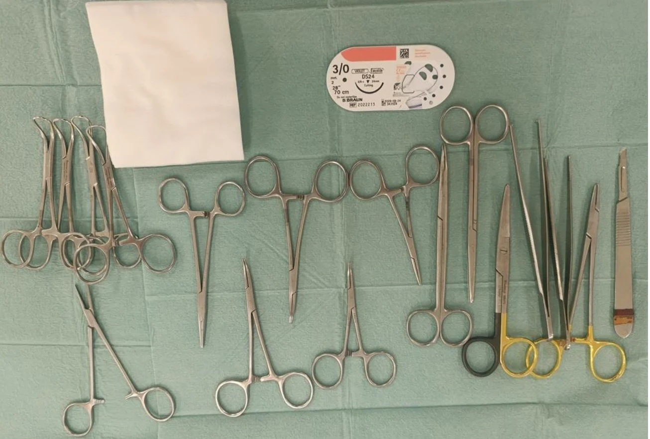 Surgical equipment laid out on a table.