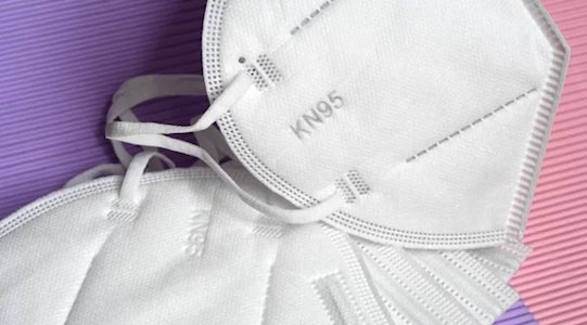 KN95 Masks Stock Image on Pink and Purple Background KN95 Masks Stock Image on Pink and Purple Background