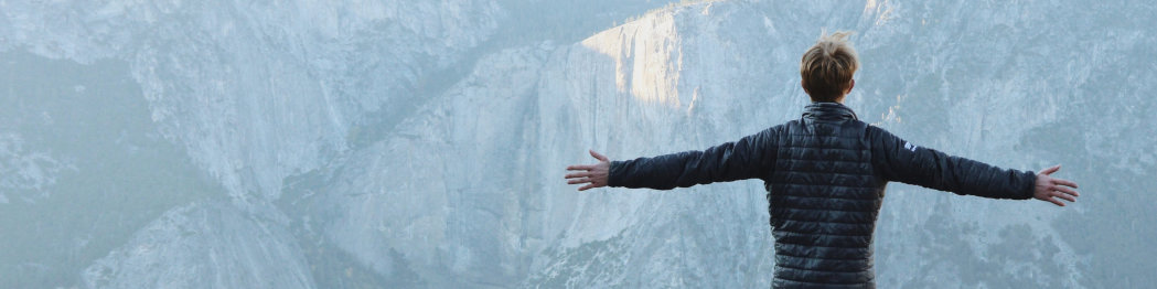 Person Spreading Arms and Breathing Fresh Air Above Yosemite Valley by Jason Hogan - Full Landscape