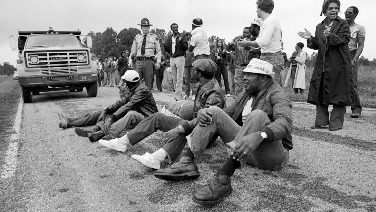 Protestors block the delivery of toxic PCB waste to a landfill in Afton, North Carolina, 1982