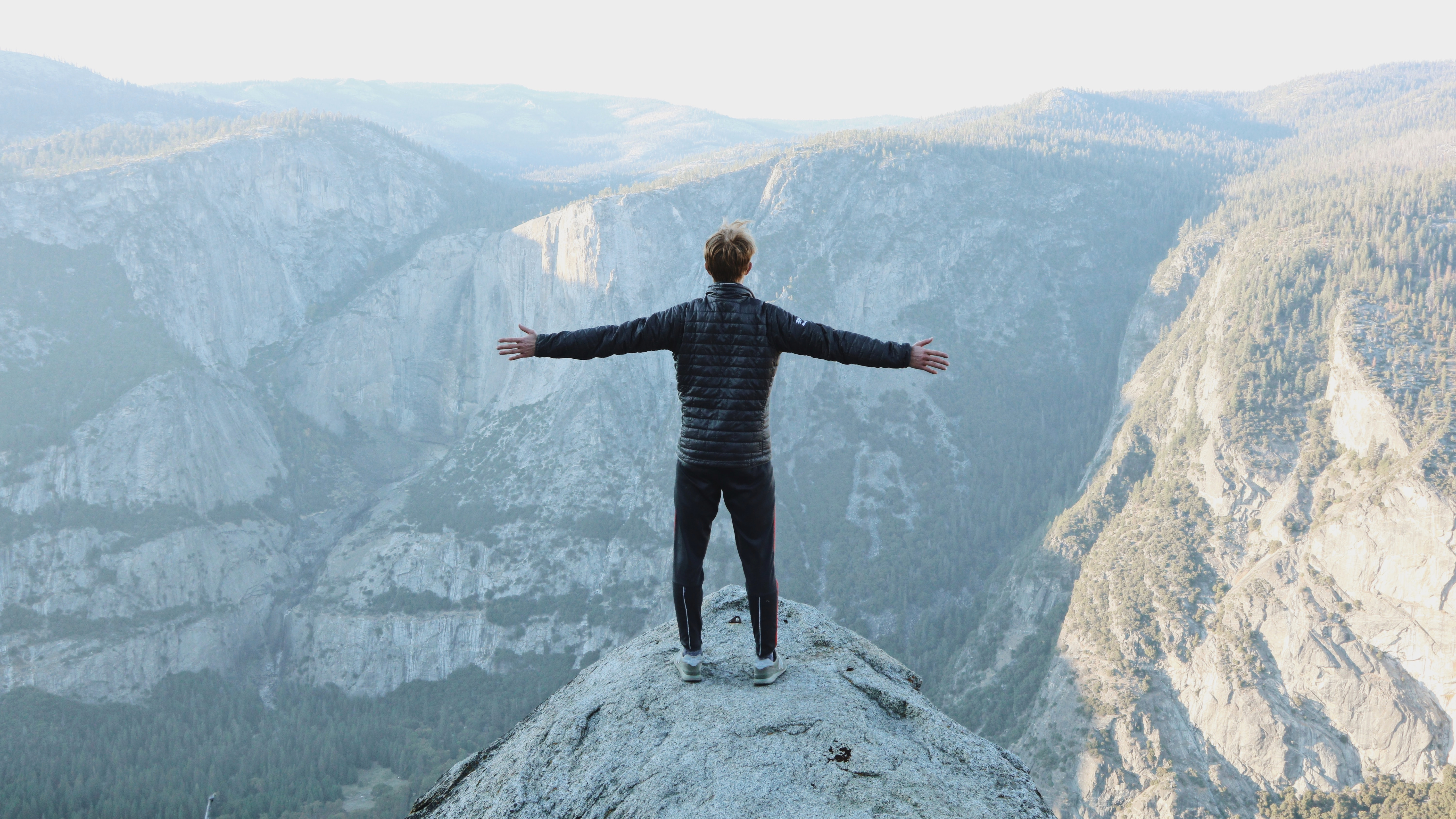 Person Spreading Arms and Breathing Fresh Air Above Yosemite Valley by Jason Hogan