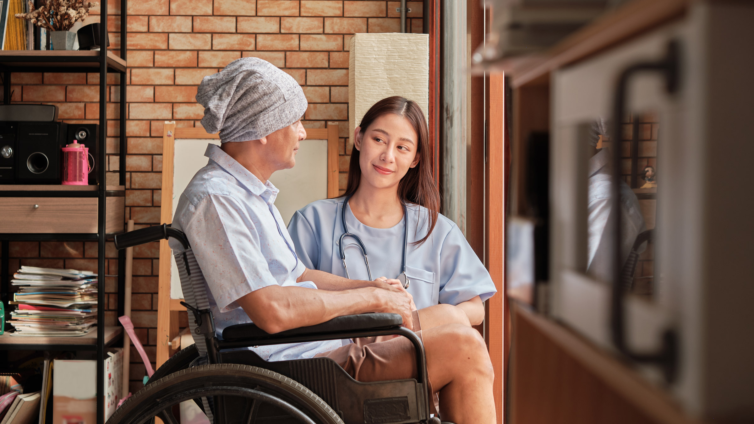 Prostate cancer: hcp talking to cancer patient in wheelchair 1327113421
