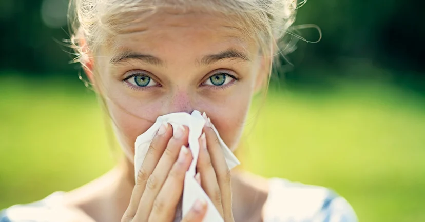 Woman sneezing