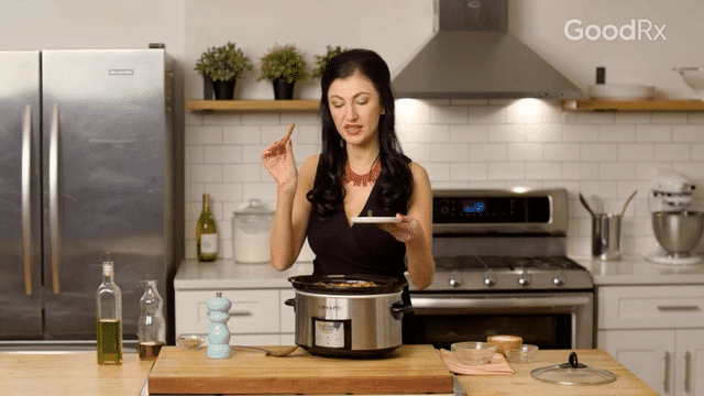 Add cooked onions, garlic, oregano, cinnamon stick, salt, pepper, bay leaf, chopped mushrooms, chickpeas, and canned tomatoes to your slow cooker with your eggplant.