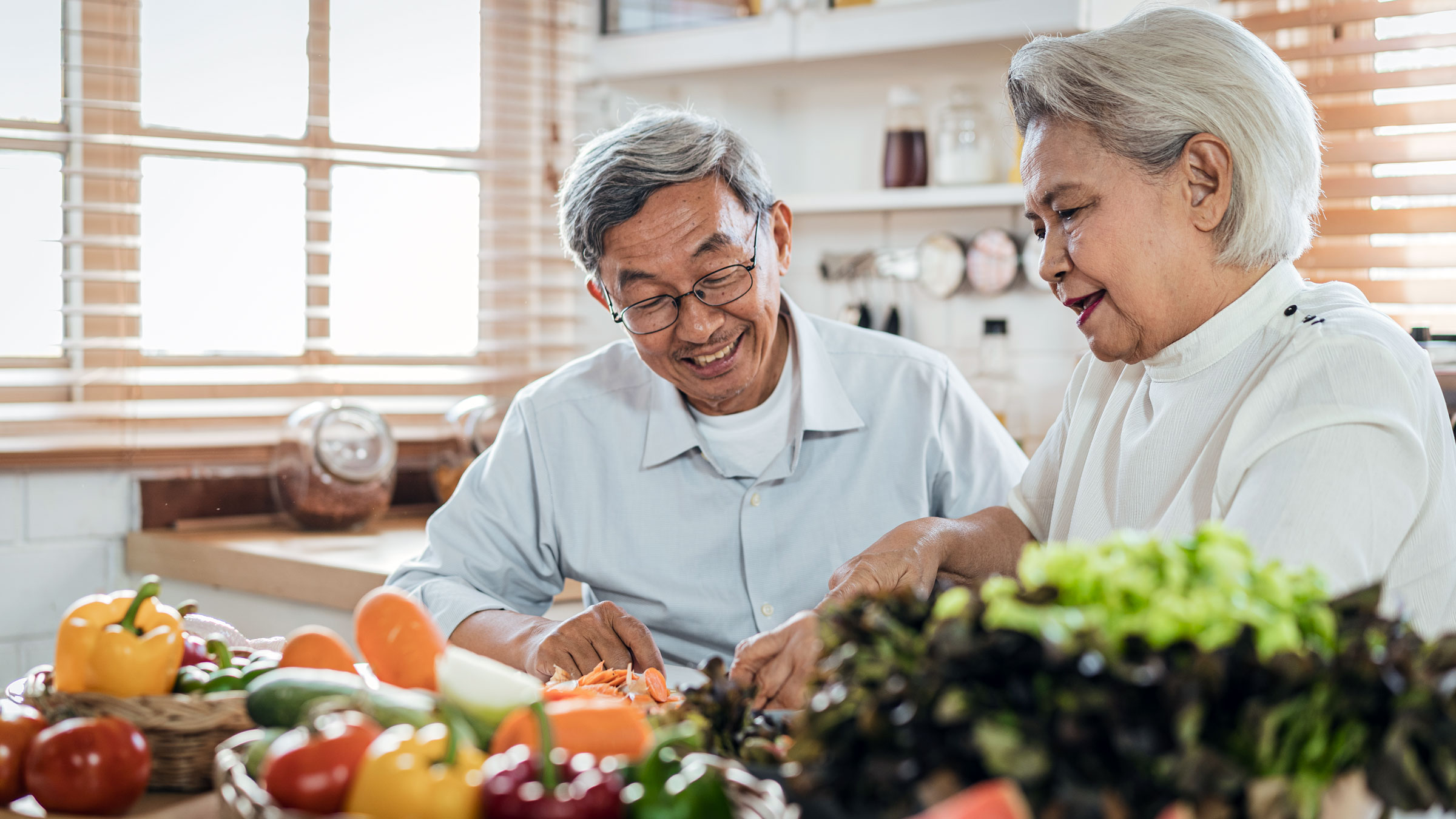 Insurance: Early retirement: senior couple prepping food 1190205448