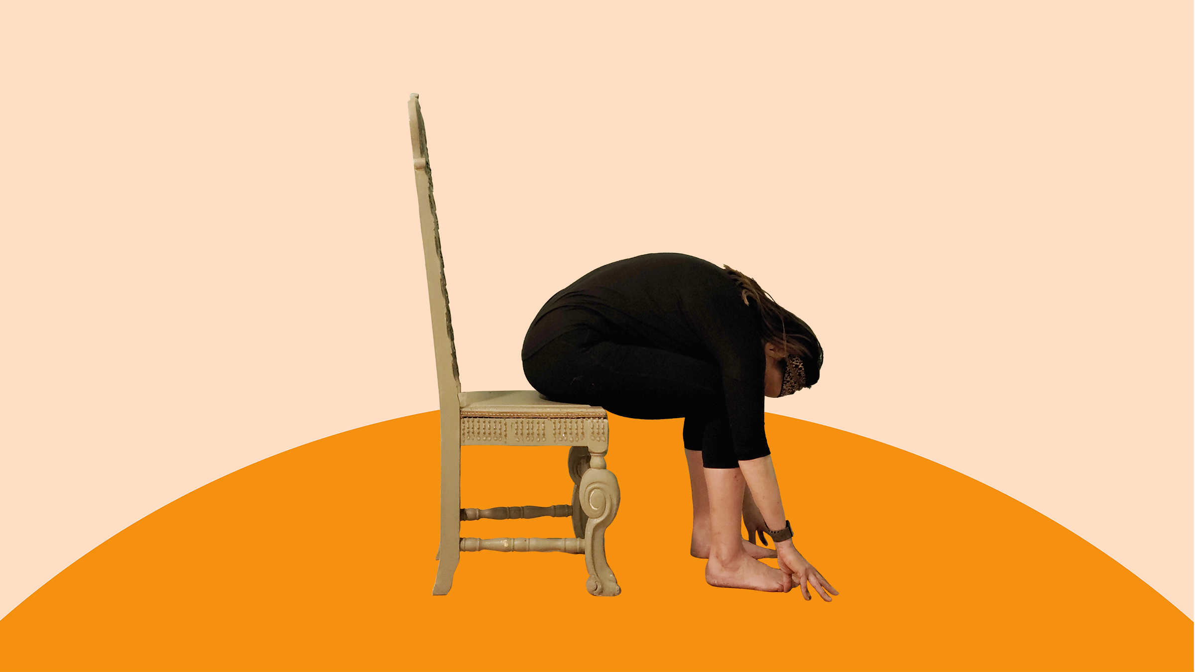 A woman bends forward while sitting on a chair.