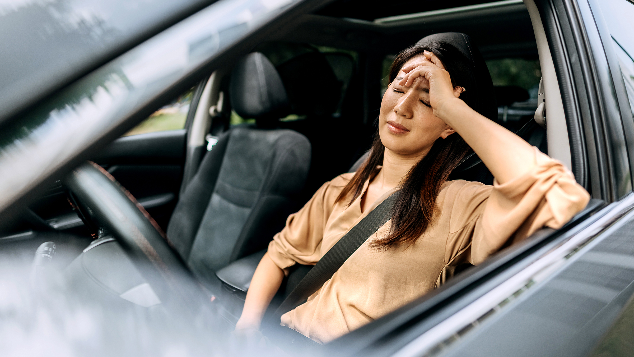 Mental Health: woman upset in drivers seat 1663262600