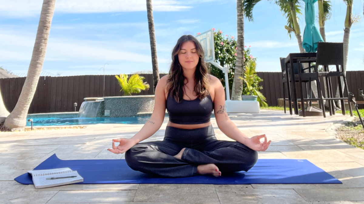 Halle Buttafuso is pictured doing a yoga pose.